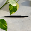 Black eyebrow pencil with spooly tip for precise application in automatic design