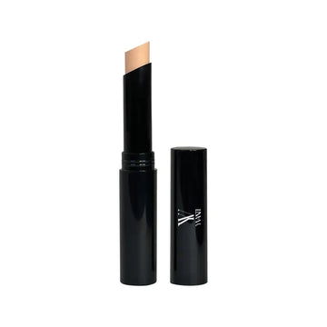 Creme Concealer Stick in black tube, ideal for covering dark spots with precision