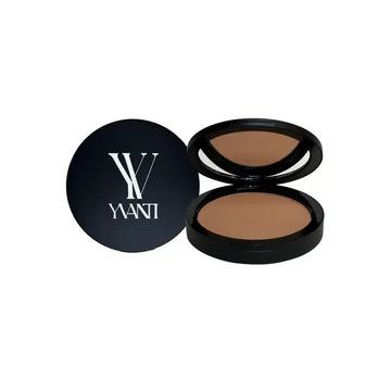 Compact powder foundation in a black case with YANI branding, featuring iron oxide