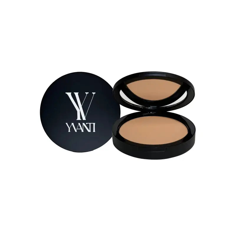 Compact powder foundation in black case featuring YANI branding and iron oxide