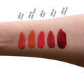 Swatches of red lipstick shades on arm for Liquid Blush - Pinch by Aevanti