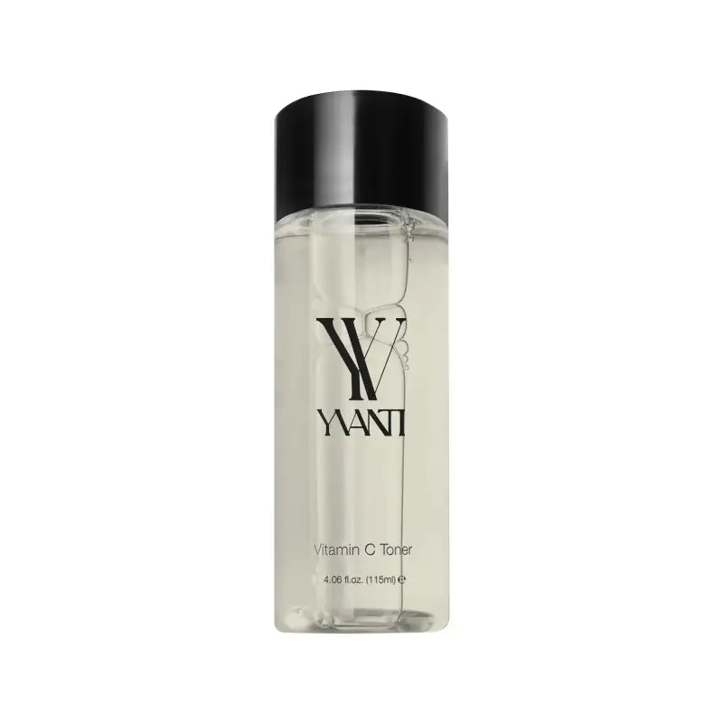 Clear bottle of Yani Vitamin C Toner with black cap, enriched with witch hazel and leaf extract